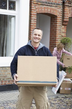 Person organizing boxes in a secure Crouchend storage space