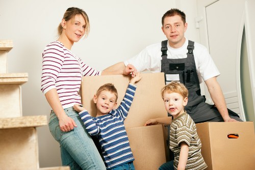 Professional movers loading furniture for house removals in Crouchend