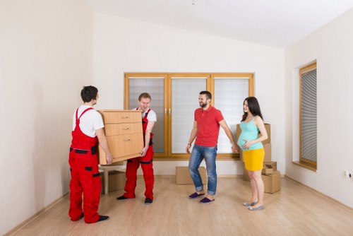 Boxes and furniture being assessed for a transparent Crouch End storage quote